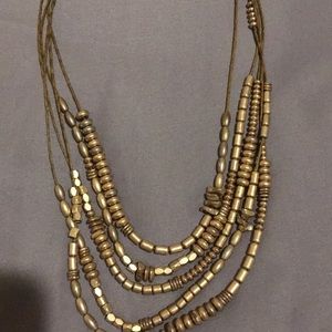 Lovely 5 strand, gold-tone necklace